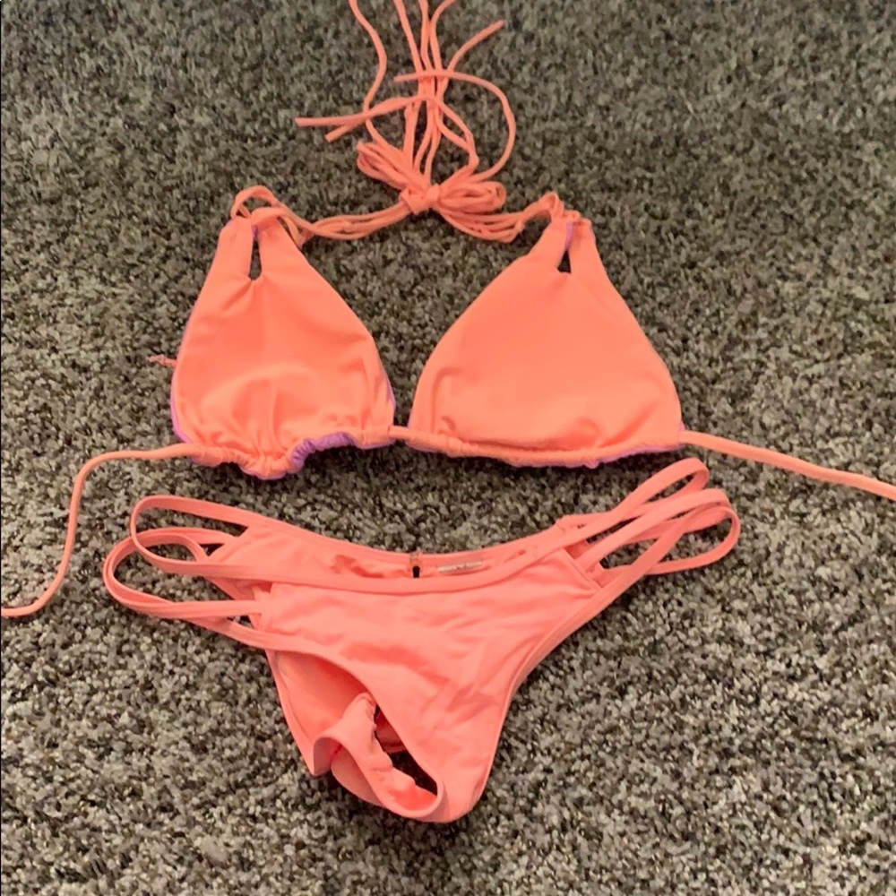 Coral and purple reversible top bikini.